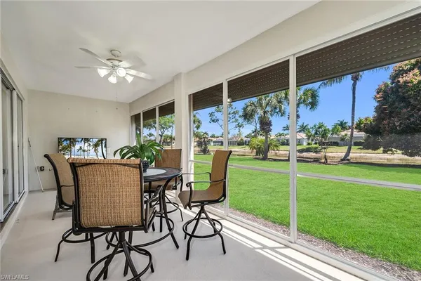 a view of a dining room with furniture window and outside view