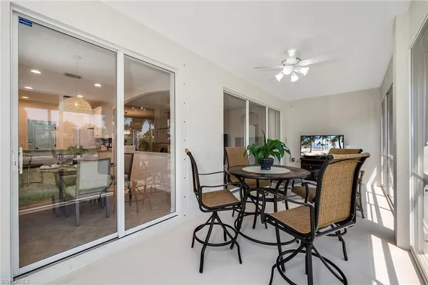 a view of a dining room with furniture and a table