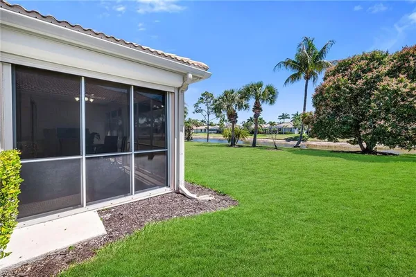 a garden with trees in front of it