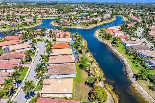 an aerial view of residential houses with outdoor space