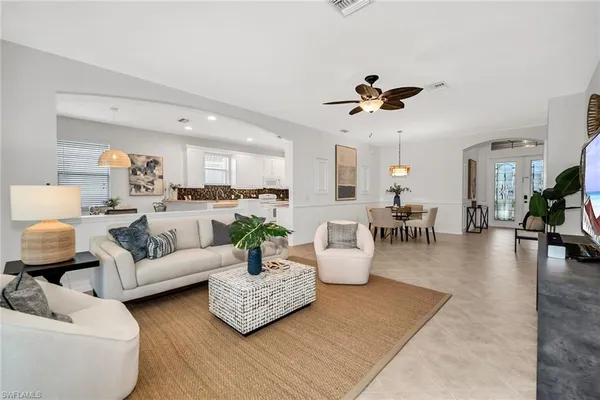 a living room with furniture or couch and a dining table