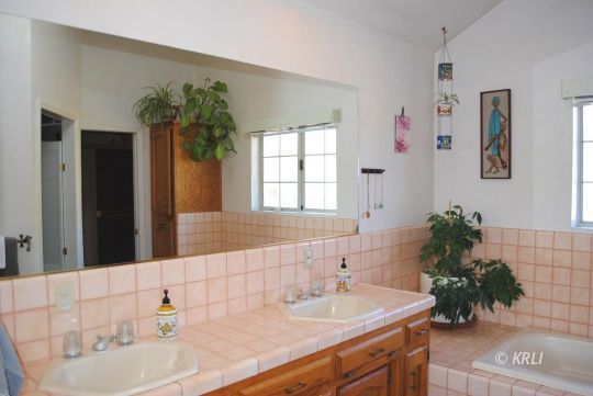 595 Evans Road Wofford Heights, CA 93285 - Photo 26 of 43 a bathroom with a sink a vanity and a mirror