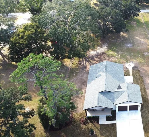a view of balcony with table and chairs and potted plants