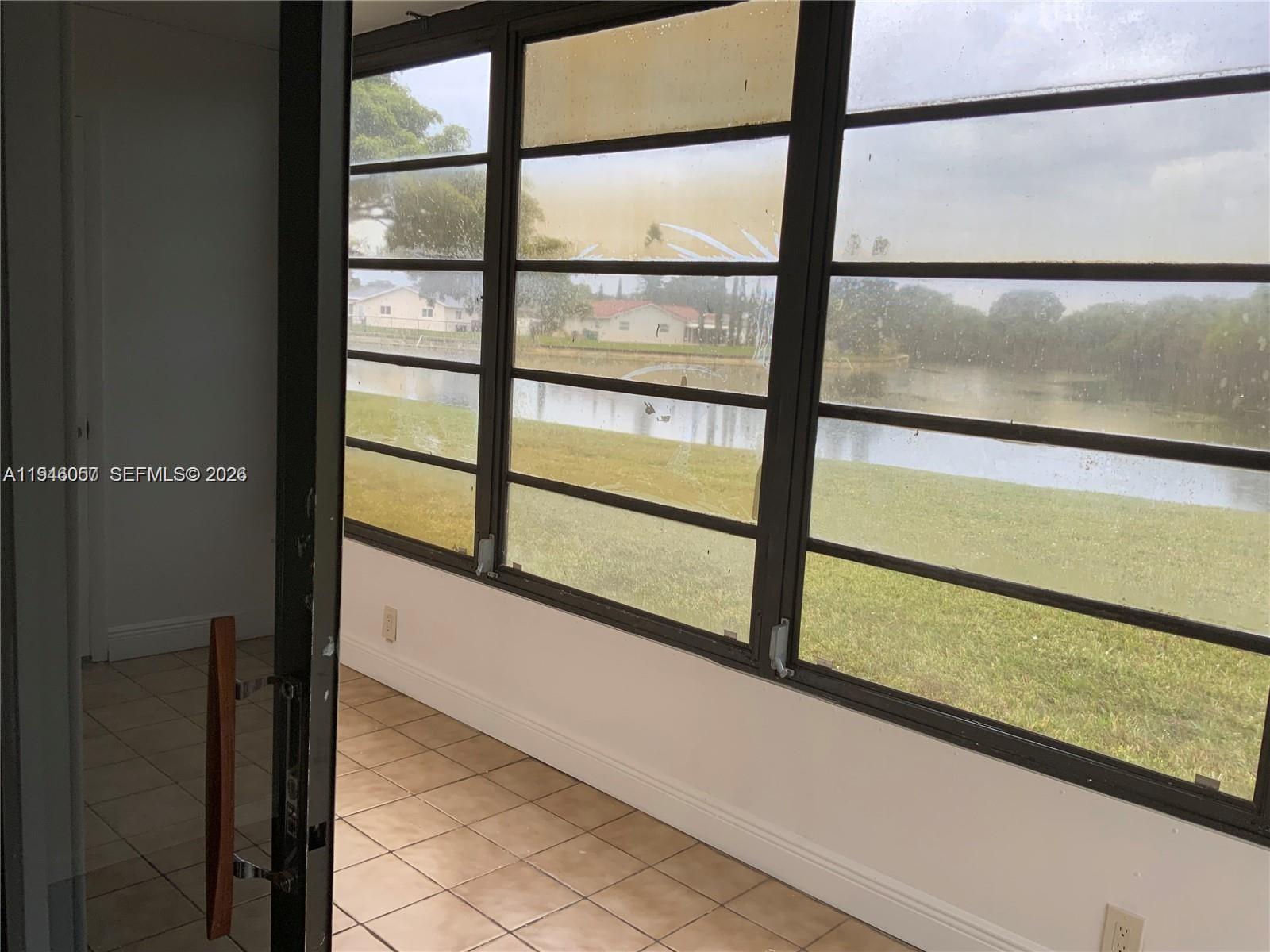 9920 Northwest 68th Place, Unit 110 Tamarac, FL 33321 - Photo 17 of 22 a view of a balcony from a window
