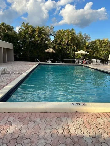 a view of swimming pool with outdoor seating