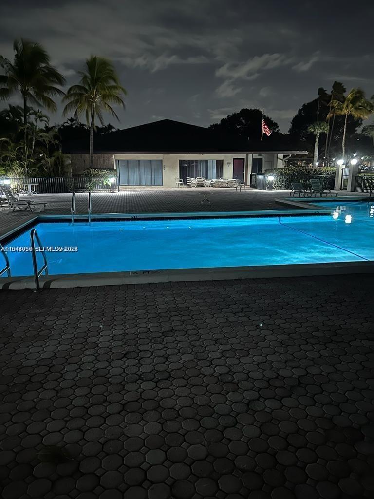 9920 Northwest 68th Place, Unit 110 Tamarac, FL 33321 - Photo 21 of 22 a view of swimming pool with outdoor seating