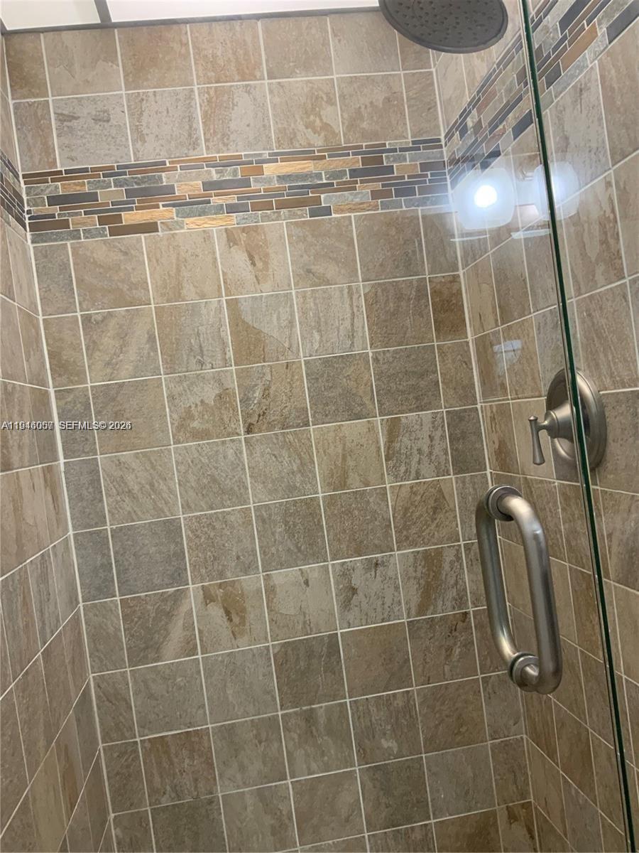 9920 Northwest 68th Place, Unit 110 Tamarac, FL 33321 - Photo 10 of 22 a bathroom with a shower