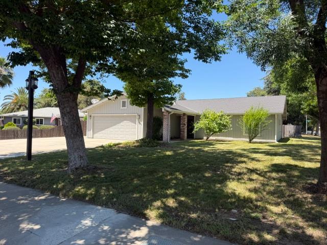 2601 Temperate Court Modesto, CA 95358 - Photo 2 of 24 a backyard of a house with table and chairs
