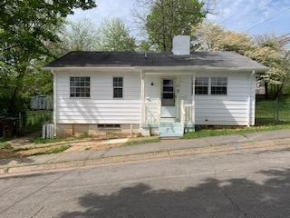 100 Temple Road Oak Ridge, TN 37830 - Photo 1 of 10 a front view of a house with a yard
