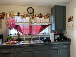 100 Temple Road Oak Ridge, TN 37830 - Photo 2 of 10 a kitchen with stainless steel appliances granite countertop a sink and cabinets