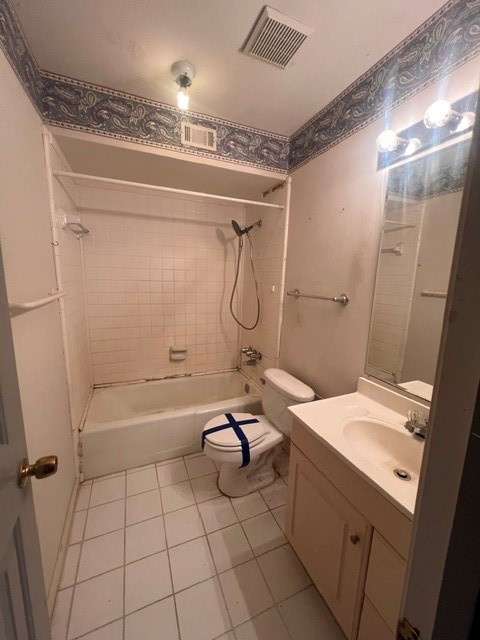 6304 South Rice Avenue Bellaire, TX 77401 - Photo 10 of 16 a bathroom with a granite countertop sink a toilet and shower