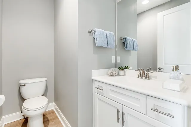 a view of a workspace with furniture and wooden floor