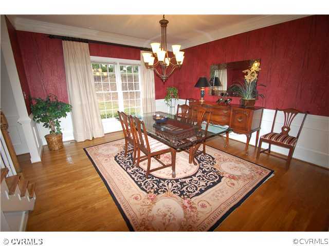 14331 Crossings Ridge Drive Midlothian, VA 23113 - Photo 4 of 12 a living room with furniture a chandelier a rug and a large window