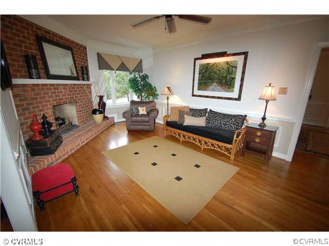 14331 Crossings Ridge Drive Midlothian, VA 23113 - Photo 6 of 12 a living room with furniture and a fireplace