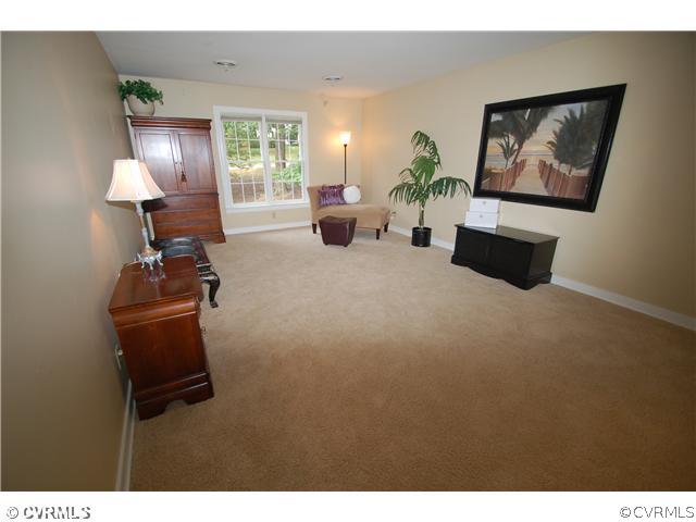14331 Crossings Ridge Drive Midlothian, VA 23113 - Photo 10 of 12 a living room with furniture and a lamp