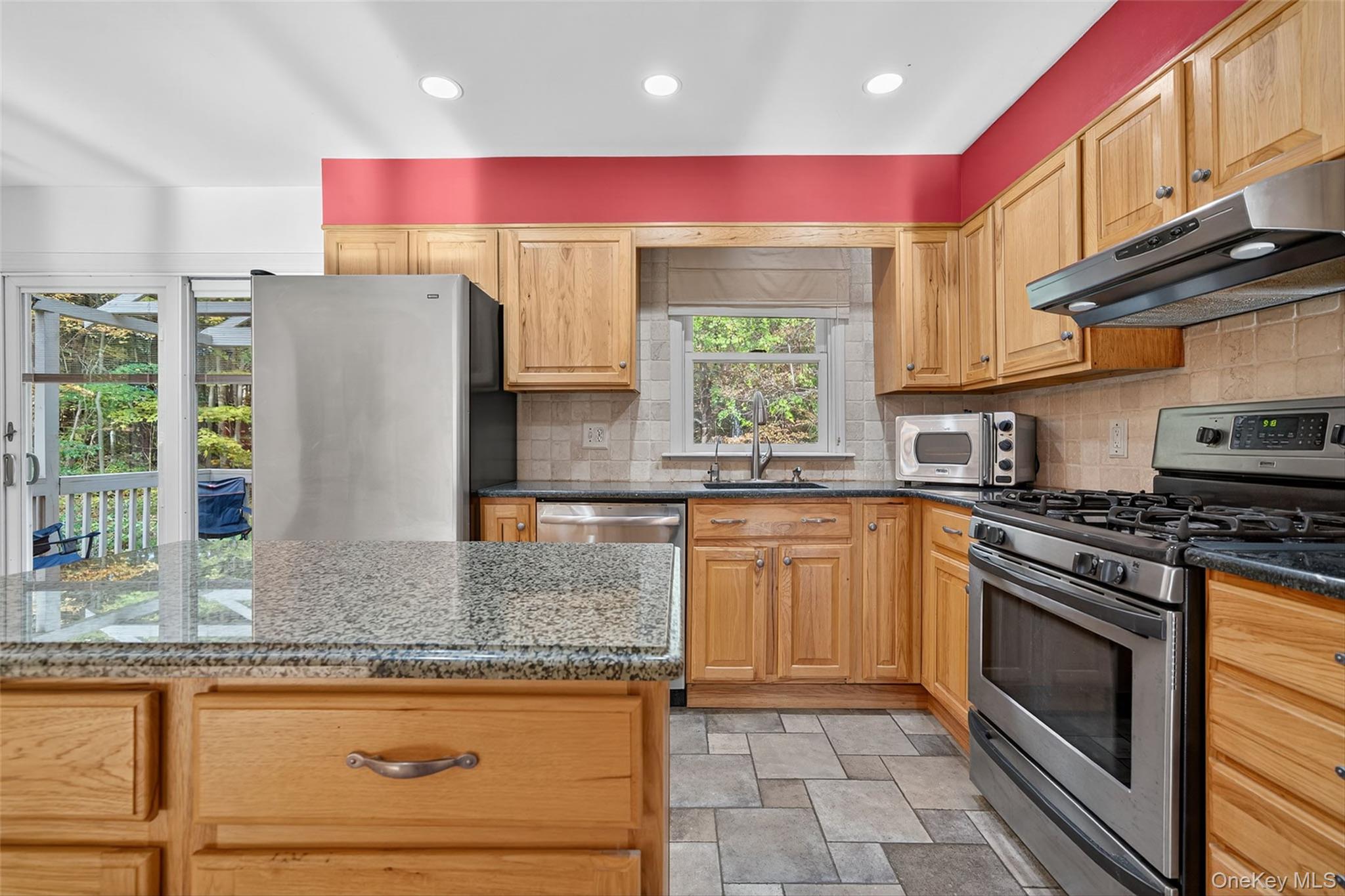 15 Nelson Road Monroe, NY 10950 - Photo 13 of 50 a kitchen with stainless steel appliances granite countertop a stove a sink and a microwave