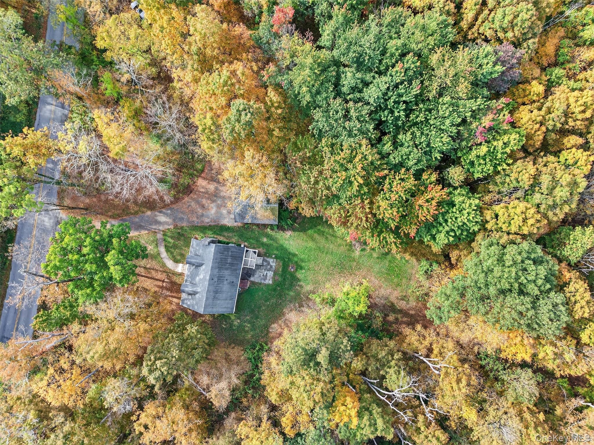 15 Nelson Road Monroe, NY 10950 - Photo 2 of 50 a backyard of a house with a yard and outdoor seating