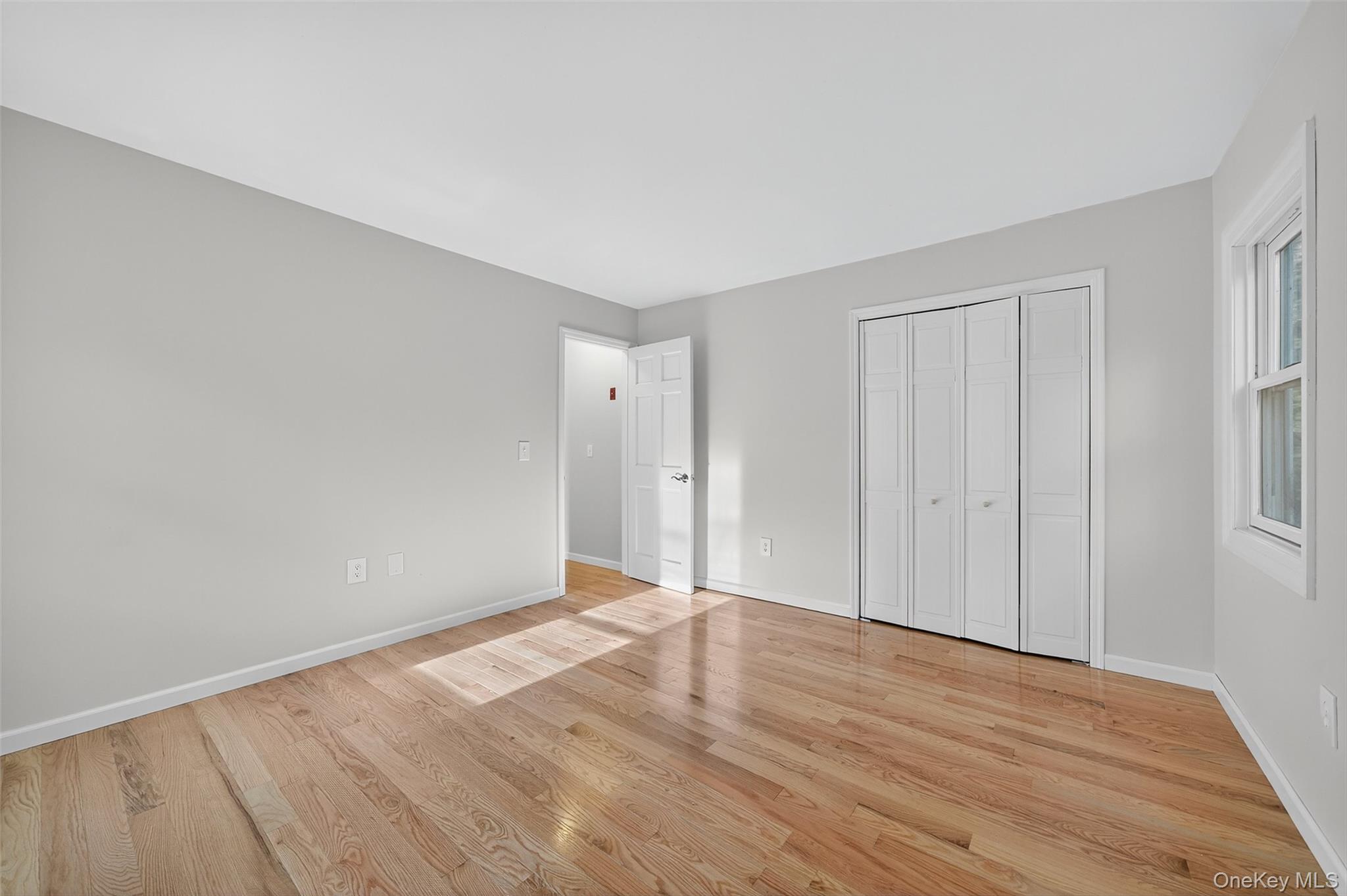 15 Nelson Road Monroe, NY 10950 - Photo 20 of 50 a view of an empty room with wooden floor