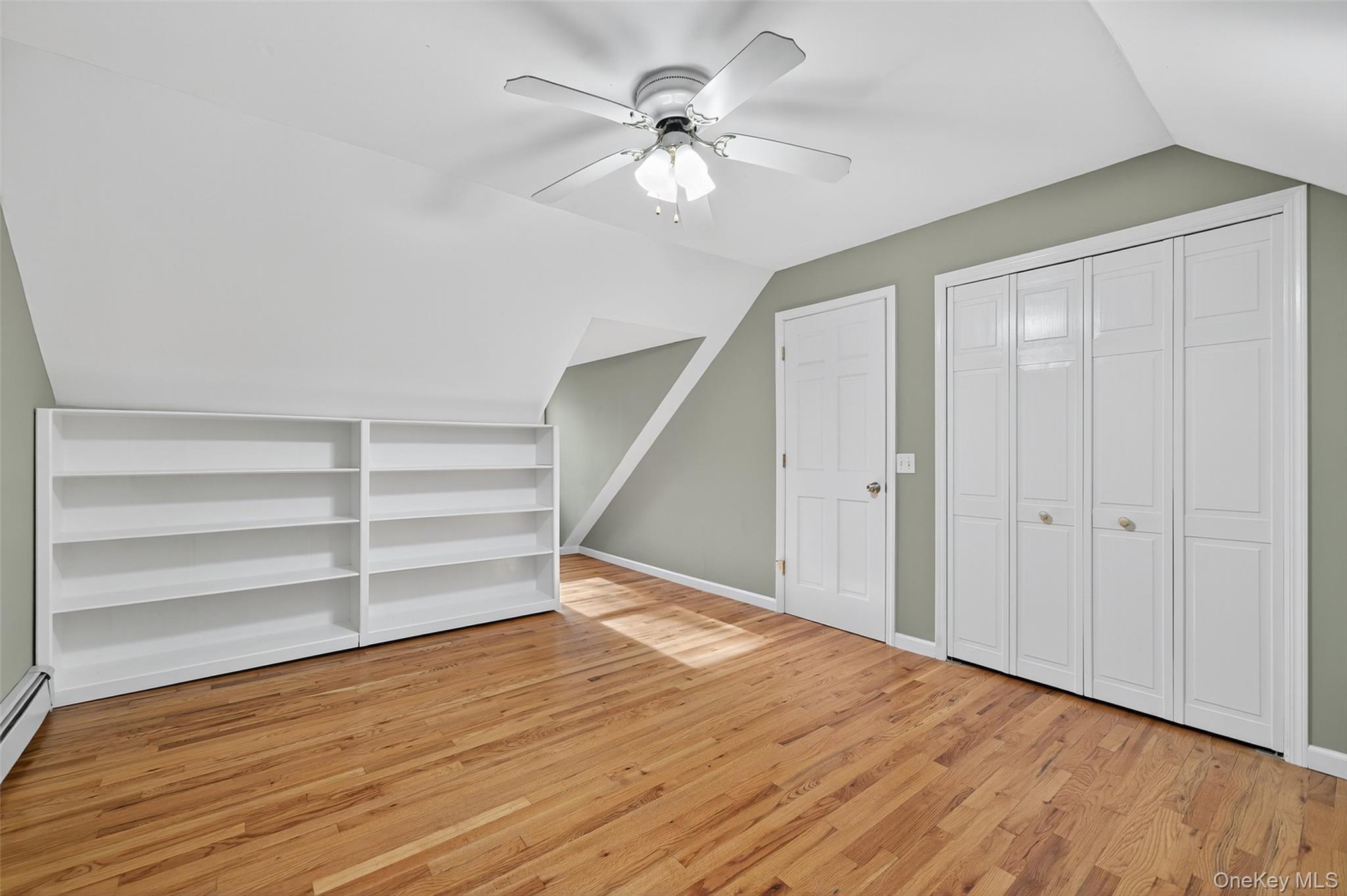 15 Nelson Road Monroe, NY 10950 - Photo 23 of 50 a view of an empty room with a window and wooden floor