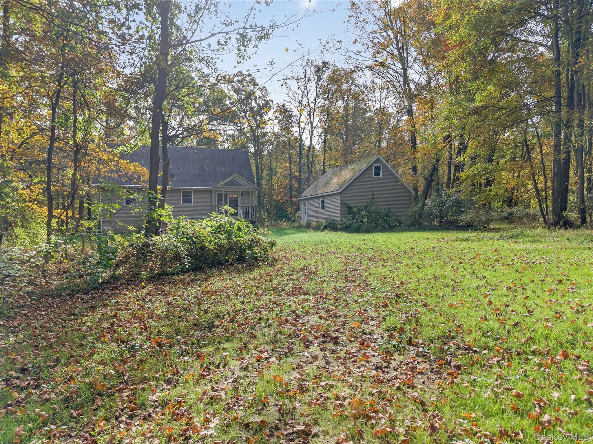 15 Nelson Road Monroe, NY 10950 - Photo 37 of 50 a backyard of a house with lots of green space