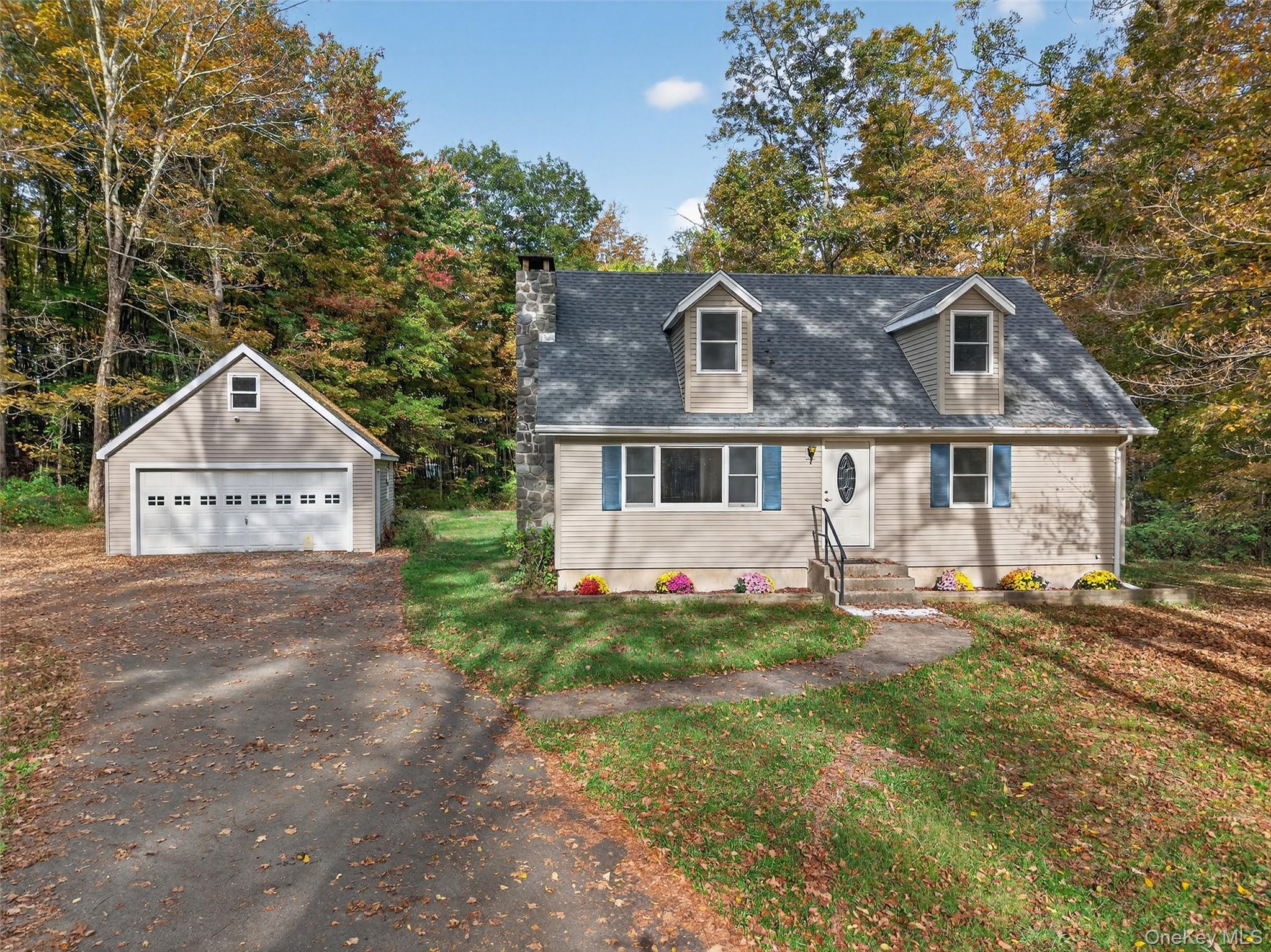 15 Nelson Road Monroe, NY 10950 - Photo 4 of 50 a front view of a house with a yard
