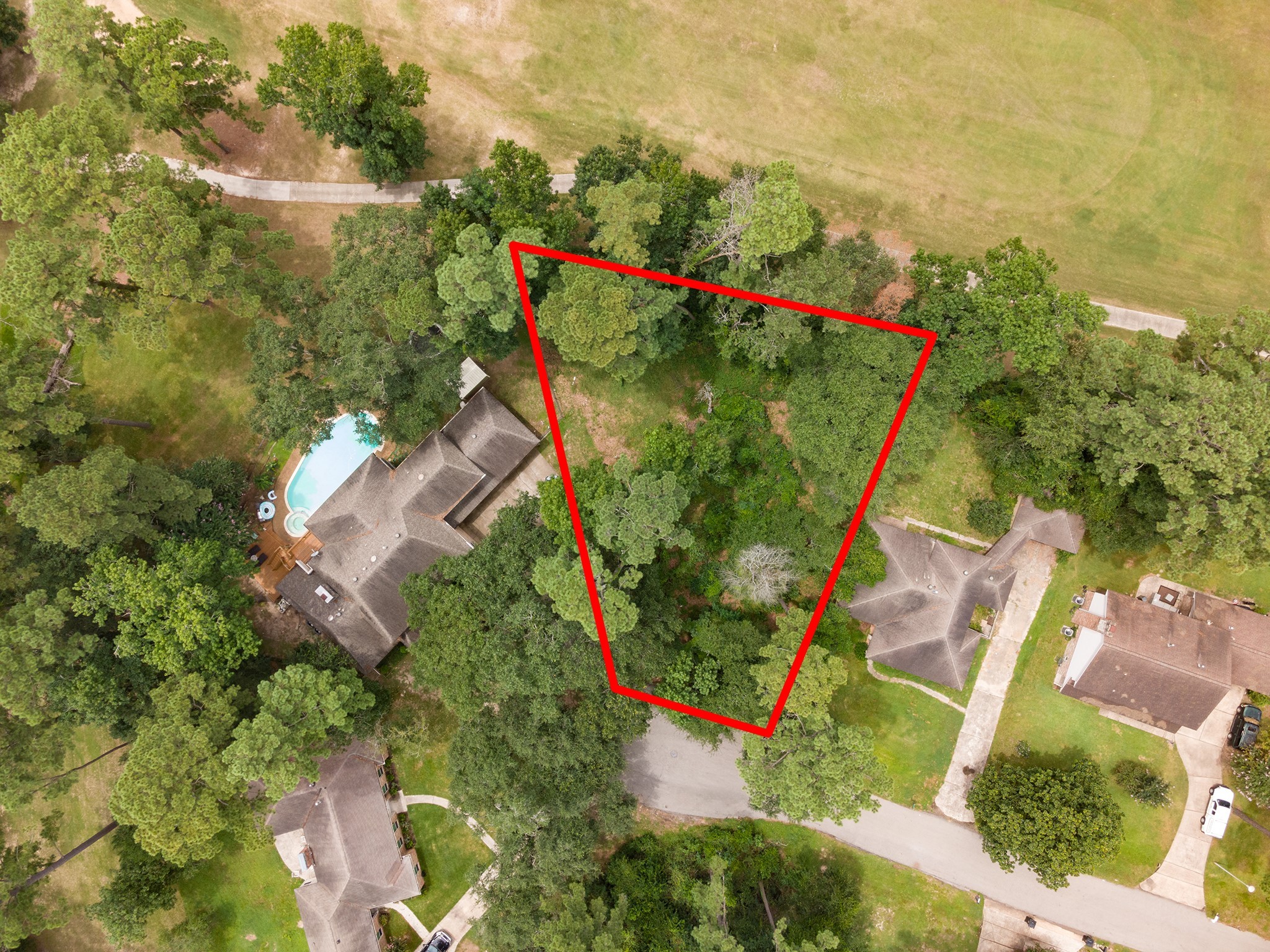 135 Jeb Stuart Lane Conroe, TX 77302 - Photo 2 of 16 an aerial view of a house with a yard and lake view