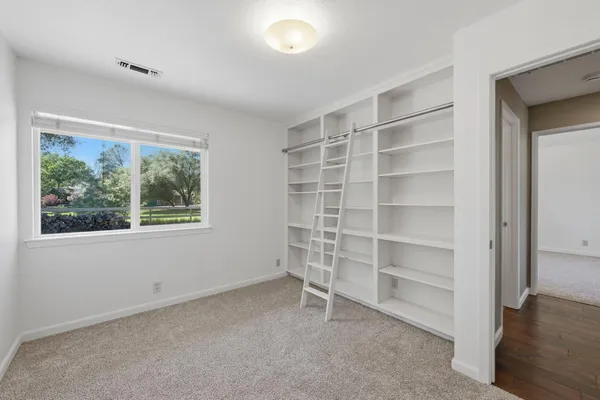 a view of a swimming pool with a lounge chair