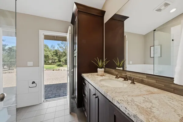 a view of a park with trees in the background