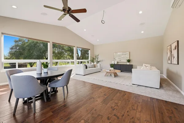 an aerial view of a house with a yard