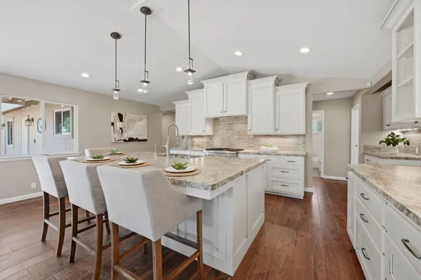 a living room with furniture and white walls