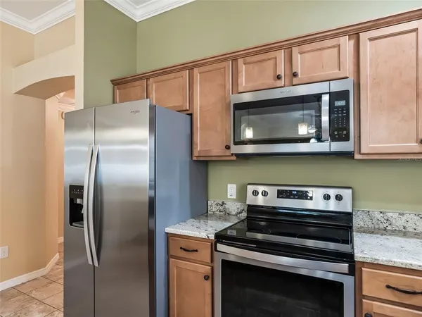 a view of a kitchen with a sink and a granite counter top