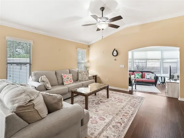 a living room with furniture and a rug