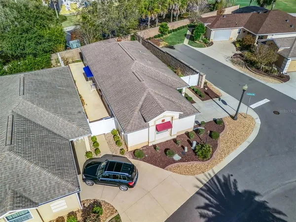 an aerial view of a house and outdoor space