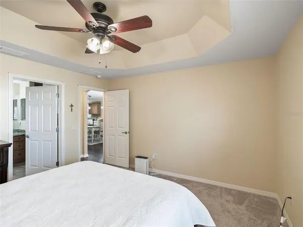 a bathroom with a granite countertop sink mirror and shower