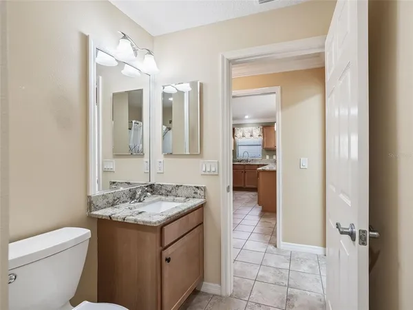 a living room with a couch and a piano
