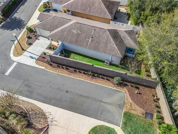 an aerial view of a house with swimming pool