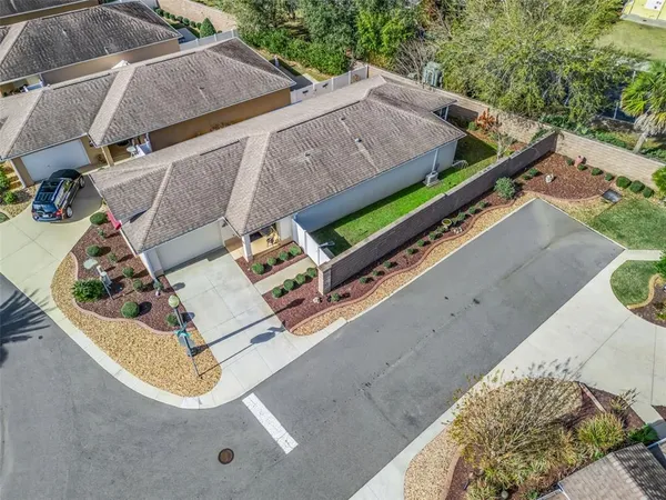 an aerial view of residential building and lake