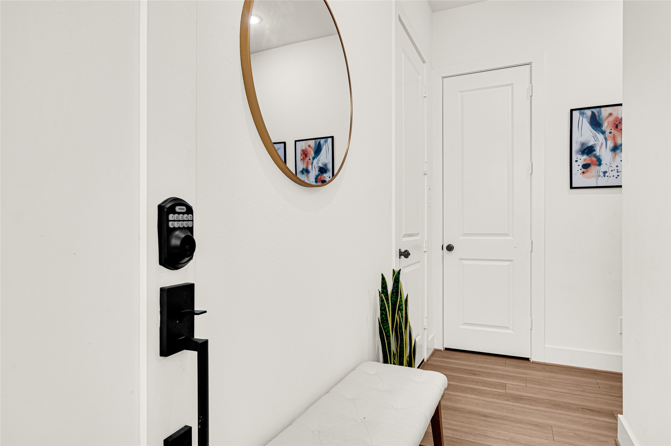 4201 Stassen Street Houston, TX 77051 - Photo 4 of 39 a view of a hallway with wooden floor and entryway