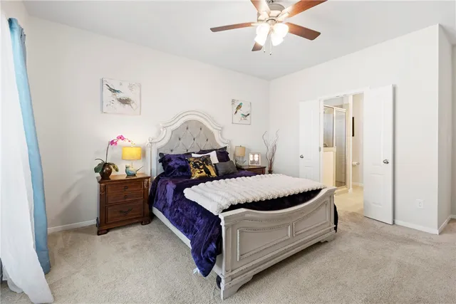 a bed room with a bed and a chandelier