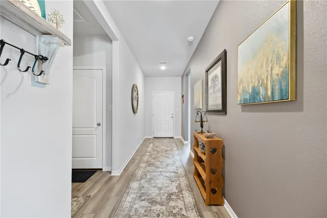 a view of hallway with washer and dryer
