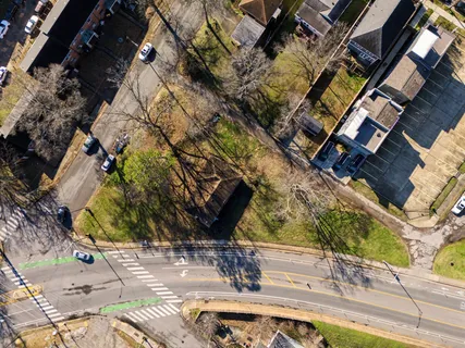 an aerial view of residential houses with outdoor space
