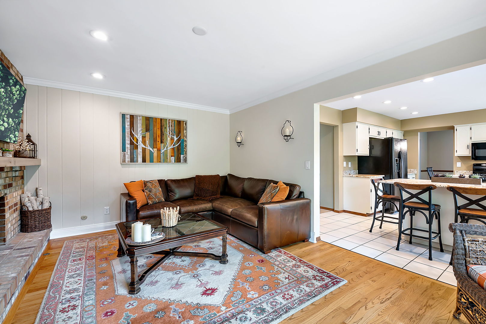 110 Bridgeport Lane Geneva, IL 60134 - Photo 12 of 27 a living room with furniture a rug and a table