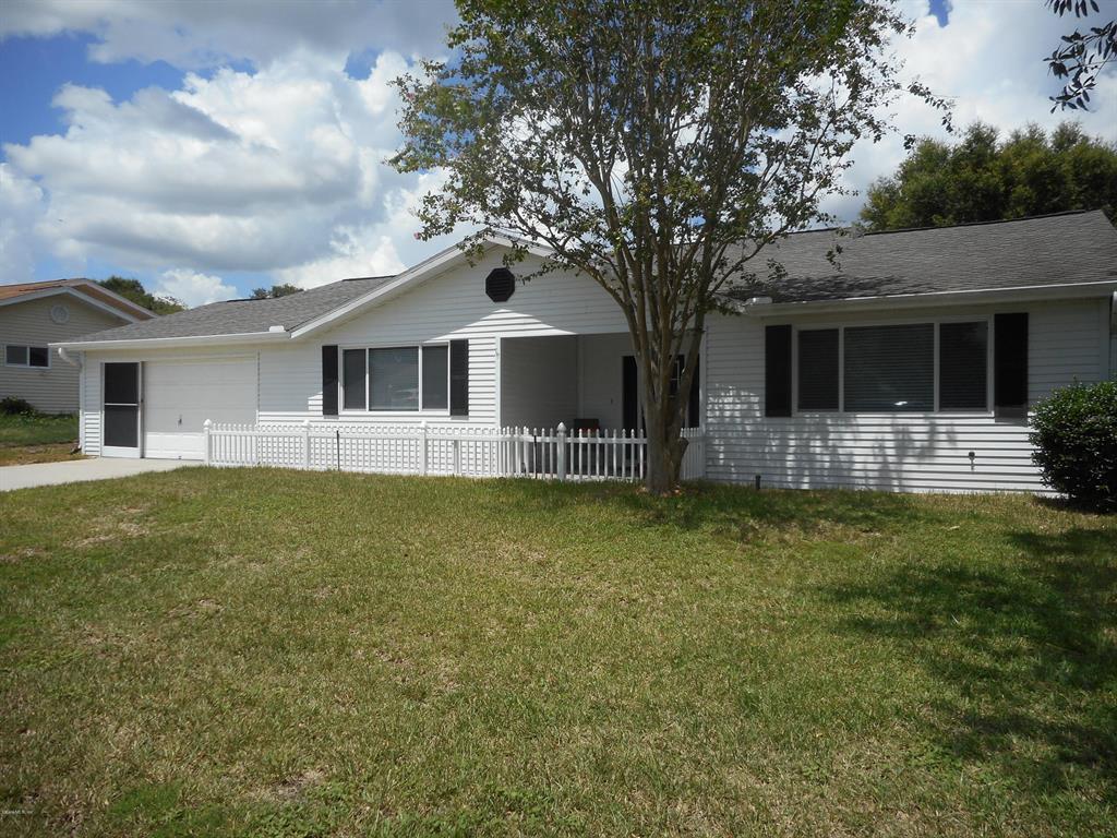 11461 Southwest 84th Court Road Ocala, FL 34481 - Photo 1 of 1 a front view of house with yard and green space