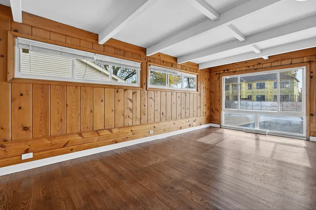 an entrance to house with wooden walls