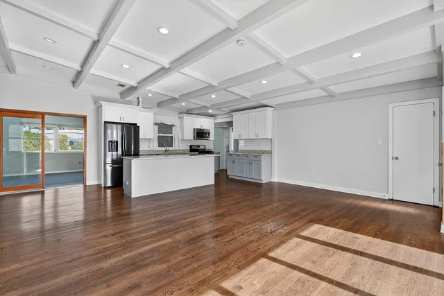 a view of large kitchen with stainless steel appliances kitchen island