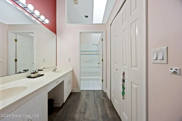 a bathroom with a sink a vanity and a mirror