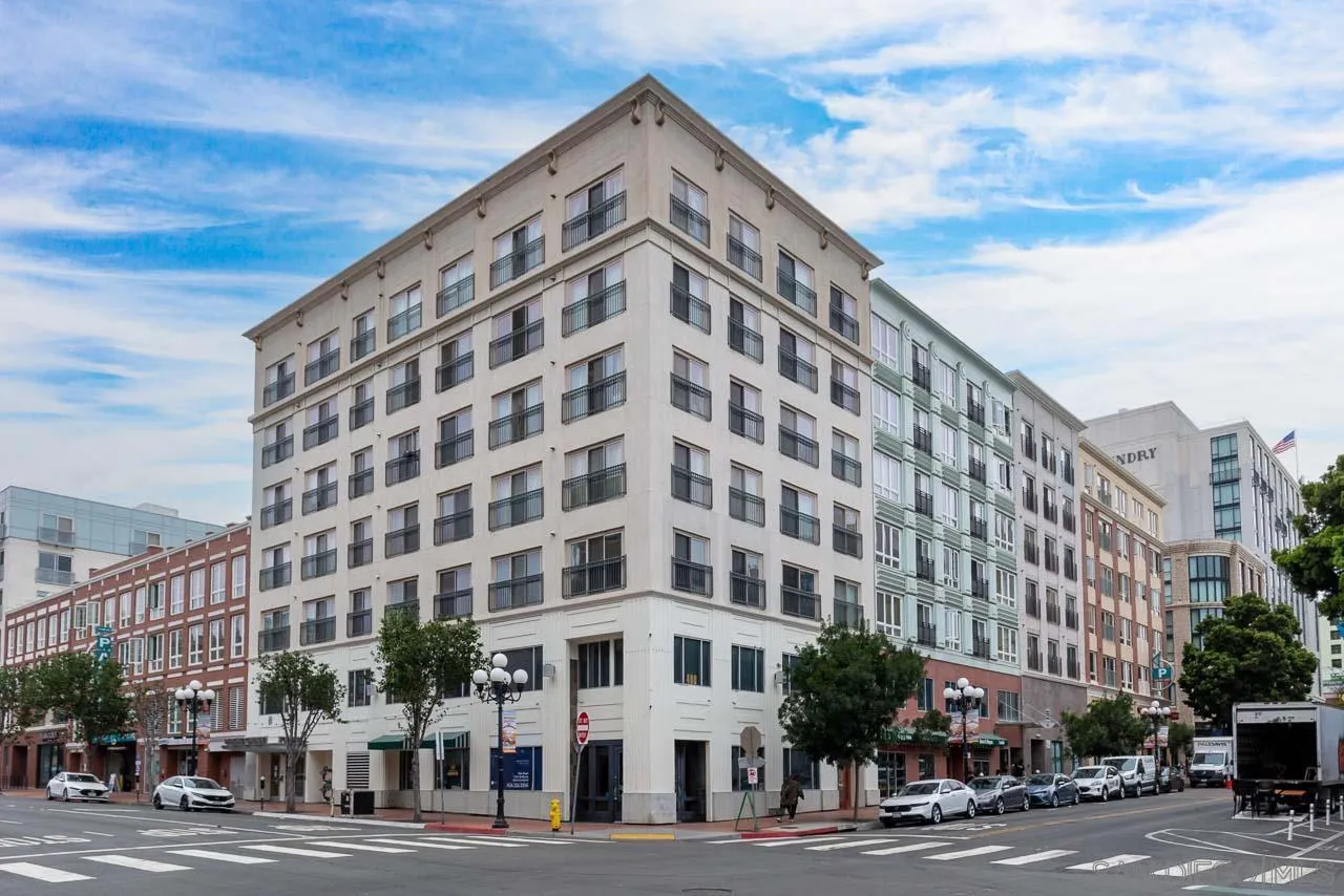 450 J Street, Unit 3151 San Diego, CA 92101 - Photo 2 of 13 a view of a tall building sitting on the corner of a street