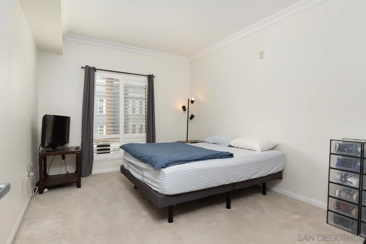 450 J Street, Unit 3151 San Diego, CA 92101 - Photo 8 of 13 a living room with furniture and a flat screen tv