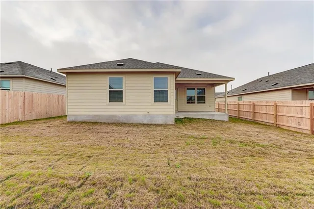 a house that has a wooden fence