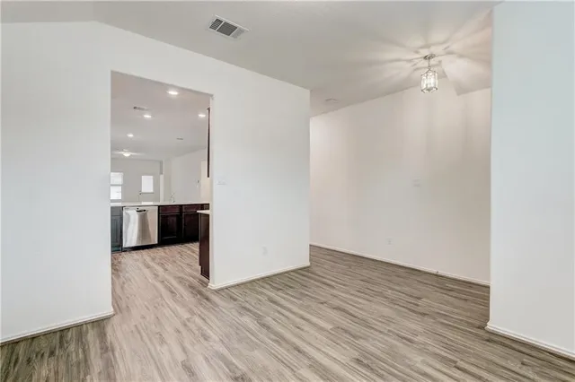 a view of a kitchen with a sink and a ceiling fan